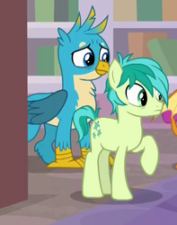 Size: 571x723 | Tagged: safe, screencap, gallus, sandbar, earth pony, griffon, pony, g4, what lies beneath, cropped, cutie mark, male, smiling, teenager, wings