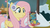 Size: 1352x754 | Tagged: safe, screencap, fluttershy, holly the hearths warmer doll, pegasus, pony, g4, my little pony best gift ever, my little pony: friendship is magic, clothes, cute, earmuffs, female, happy, mare, shyabetes, smiling, solo, sweater, winter, winter outfit