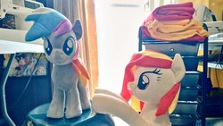 Size: 1024x577 | Tagged: safe, artist:nekokevin, oc, oc only, oc:poniko, oc:rokuchan, earth pony, pony, duo, female, happy, irl, looking at you, mare, open mouth, photo, plushie, raised hoof, sewing machine, smiling, stool