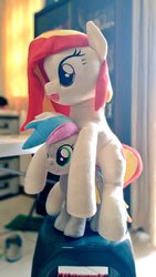 Size: 577x1024 | Tagged: safe, artist:nekokevin, oc, oc only, oc:poniko, oc:rokuchan, earth pony, pony, duo, female, happy, irl, mare, open mouth, photo, plushie, ponies riding ponies, poniko riding rokuchan, riding, sewing machine, size difference, smiling, stool