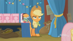 Size: 1348x754 | Tagged: safe, screencap, applejack, fluttershy, holly the hearths warmer doll, g4, my little pony best gift ever, discovery family logo, unamused