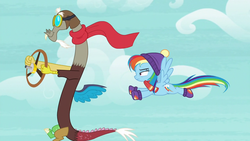 Size: 1280x720 | Tagged: safe, screencap, discord, rainbow dash, draconequus, pegasus, pony, g4, my little pony best gift ever, aviator hat, clothes, duo, female, flying, hat, male, mare, scarf, winter outfit