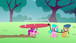 Size: 1440x807 | Tagged: safe, screencap, aquamarine, first base, lily longsocks, earth pony, pony, crusaders of the lost mark, g4, background pony, colt, female, filly, foal, male, merry-go-round, mouth hold, raised hoof, super strength, trio