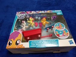 Size: 4032x3024 | Tagged: safe, apple bloom, scootaloo, sweetie belle, earth pony, pony, g4, box, cutie mark crusaders, guardians of harmony, helmet, irl, photo, pony pulls the wagon, scooter, skates, toy, wagon
