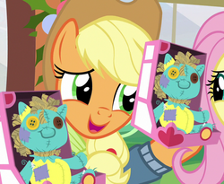Size: 878x720 | Tagged: safe, screencap, applejack, holly the hearths warmer doll, pony, best gift ever, g4, cropped, female, mare, solo focus, yay