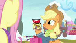 Size: 1280x720 | Tagged: safe, screencap, applejack, fluttershy, pony, g4, my little pony best gift ever, comic book, happy face