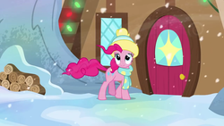 Size: 1280x720 | Tagged: safe, screencap, pinkie pie, earth pony, pony, g4, my little pony best gift ever, blowing, clothes, cute, female, hat, log, mare, scarf, snow, snowfall, solo, winter outfit