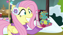Size: 1280x720 | Tagged: safe, screencap, fluttershy, holly the hearths warmer doll, pony, g4, my little pony best gift ever
