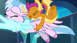 Size: 1280x720 | Tagged: safe, screencap, silverstream, smolder, classical hippogriff, dragon, hippogriff, g4, school raze, dragoness, duo, eyes closed, female, hand, magic, magic hands, out of context