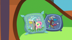 Size: 1440x809 | Tagged: safe, screencap, discord, fluttershy, discordant harmony, g4, season 7, background, couch, embroidery, female, fluttershy's cottage (interior), liminal space, male, no pony, pillow, scenic ponyville, throw pillow