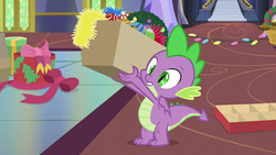 Size: 1280x720 | Tagged: safe, screencap, spike, dragon, g4, my little pony best gift ever, box, decoration, male, solo, tail, winged spike, wings
