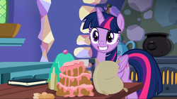 Size: 1280x720 | Tagged: safe, screencap, twilight sparkle, alicorn, pony, g4, book, cake, cauldron, female, flour, food, grin, kitchen, mare, messy hair, oven, smiling, twilight sparkle (alicorn)