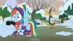 Size: 1280x720 | Tagged: safe, screencap, discord, rainbow dash, draconequus, pegasus, pony, winterchilla, g4, my little pony best gift ever, clothes, eyes closed, female, flying, handkerchief, hat, male, mare, scarf, snow, tree, winter, winter outfit