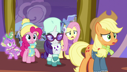 Size: 1280x720 | Tagged: safe, screencap, applejack, fluttershy, pinkie pie, rarity, spike, dragon, earth pony, pegasus, pony, unicorn, best gift ever, g4, bedazzled, clothes, earmuffs, glasses, hat, male, raised hoof, scarf, sweater, winged spike, wings, winter outfit