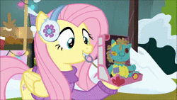 Size: 854x480 | Tagged: safe, edit, edited screencap, screencap, sound edit, fluttershy, holly the hearths warmer doll, pegasus, pony, g4, my little pony best gift ever, advisor voice, animated, clothes, female, i love being an expensive toy, mare, meme, ruthless conglomerate, sound, stellaris, sweater, webm, winter outfit