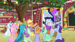 Size: 1280x720 | Tagged: safe, screencap, amber grain, applejack, auburn vision, clever musings, gallus, november rain, ocellus, peppermint goldylinks, silverstream, snowy quartz, strawberry scoop, violet twirl, changedling, changeling, earth pony, griffon, hippogriff, pegasus, pony, unicorn, g4, hearth's warming shorts, my little pony best gift ever, mystery voice, apple tree, applejack's barn, applejack's hat, background pony, barn, bow, cowboy hat, cutie mark, female, friendship student, hair bow, hat, hearth's warming, hearth's warming decorations, kunzite (sailor moon), male, mare, stallion, tree, wings