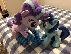 Size: 2048x1536 | Tagged: safe, artist:nekokevin, starlight glimmer, oc, oc:sierra nightingale, pegasus, pony, unicorn, series:nekokevin's glimmy, g4, bed, canon x oc, clothes, female, irl, male, mare, photo, plushie, sitting, size difference, smiling, socks, stallion, striped socks