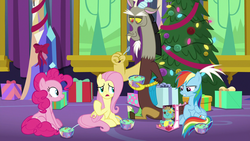 Size: 1280x720 | Tagged: safe, screencap, discord, fluttershy, holly the hearths warmer doll, pinkie pie, rainbow dash, draconequus, earth pony, pegasus, pony, best gift ever, g4, bowl, female, food, hearth's warming tree, mare, present, pudding, puddinghead's pudding, sitting, spoon, tree