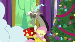 Size: 1280x720 | Tagged: safe, screencap, discord, fluttershy, draconequus, pegasus, pony, g4, my little pony best gift ever, christmas, christmas presents, christmas tree, cute, discute, duo, holiday, hug, shyabetes, tree