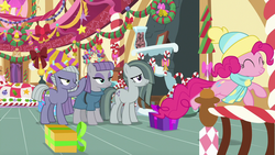 Size: 1280x720 | Tagged: safe, screencap, limestone pie, marble pie, maud pie, pinkie pie, earth pony, pony, g4, my little pony best gift ever, bed, bow, clothes, dress, hat, pie sisters, present, scarf, siblings, sisters, streamers, sugarcube corner, winter outfit, wreath