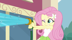 Size: 1912x1072 | Tagged: safe, screencap, fluttershy, equestria girls, equestria girls specials, g4, my little pony equestria girls: dance magic, bubble, canterlot high, car wash, clothes, cute, eyeshadow, female, grin, hose, makeup, one eye closed, shyabetes, skirt, sleeveless, smiling, solo, tank top, this will end in wet tshirts, water, wink