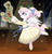 Size: 1200x1244 | Tagged: safe, artist:shadobabe, discord, princess celestia, alicorn, draconequus, semi-anthro, g4, arm hooves, ballerina, ballet, bow, cewestia, clothes, cute, cutelestia, dancing, dress, female, filly, glowing horn, hair bow, horn, magic, male, nutcracker doll, pink-mane celestia, ponytail, ship:dislestia, shipping, straight, telekinesis, the nutcracker, younger