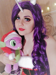 Size: 2448x3264 | Tagged: safe, artist:shadeila, rarity, spike, human, g4, christmas, clothes, cosplay, costume, hat, high res, holiday, horn, irl, irl human, photo, plushie, santa hat, sleeveless
