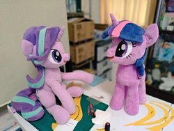Size: 1024x768 | Tagged: safe, artist:nekokevin, starlight glimmer, twilight sparkle, pony, unicorn, series:nekokevin's glimmy, g4, desk, duo, female, irl, looking at each other, mare, open mouth, photo, plushie, raised hoof, sitting, smiling, unicorn twilight