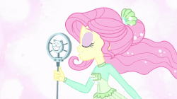 Size: 1000x560 | Tagged: safe, screencap, fluttershy, equestria girls, equestria girls series, so much more to me, animated, cute, female, gif, microphone, one eye closed, shyabetes, solo, wink