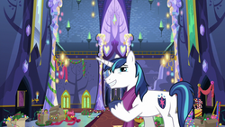 Size: 1280x720 | Tagged: safe, screencap, shining armor, pony, unicorn, g4, my little pony best gift ever, butt, candy, candy cane, christmas, christmas lights, christmas wreath, clothes, food, holiday, male, plot, raised hoof, scarf, solo, stallion, twilight's castle, winter outfit, wreath