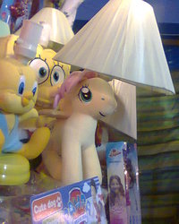 Size: 480x600 | Tagged: safe, fluttershy, pony, g4, bootleg, irl, lamp, looney tunes, male, paw patrol, photo, plushie, spongebob squarepants, spongebob squarepants (character), tweety bird, wat