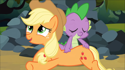 Size: 1038x582 | Tagged: safe, screencap, applejack, spike, dragon, earth pony, pony, g4, spike at your service, back scratching, butt touch, excited, female, hand on butt, lip bite, male, mare, rock