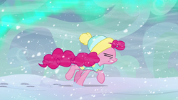 Size: 1280x720 | Tagged: safe, screencap, pinkie pie, earth pony, pony, g4, my little pony best gift ever, aurora borealis, eyes closed, female, mare, raised hoof, snow, snowfall, solo, walking, wind