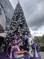 Size: 720x960 | Tagged: safe, rarity, twilight sparkle, alicorn, pony, g4, book, christmas, christmas tree, holiday, irl, photo, singapore, statue, tree, twilight sparkle (alicorn)