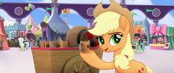 Size: 1920x804 | Tagged: safe, screencap, applejack, earth pony, pony, g4, my little pony: the movie, applejack's hat, balloon, cake, cart, cider, cotton candy, cowboy hat, cup, female, flag, food, hat, mug, smiling, solo, tankard
