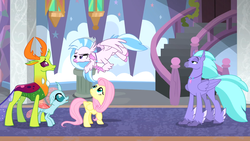 Size: 1920x1080 | Tagged: safe, screencap, fluttershy, ocellus, seaspray, silverstream, thorax, changedling, changeling, classical hippogriff, hippogriff, pegasus, pony, g4, school daze, season 8, changeling king, duo, feathered fetlocks, female, flying, jewelry, king thorax, looking up, male, necklace, smiling