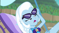 Size: 1280x720 | Tagged: safe, screencap, trixie, equestria girls, equestria girls series, forgotten friendship, g4, beach chair, chair, clothes, discovery family logo, female, solo, sunglasses, swimsuit