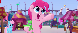 Size: 1920x804 | Tagged: safe, screencap, gummy, pinkie pie, wind whistler (g4), alligator, earth pony, pegasus, pony, g4, my little pony: the movie, apple family member, background pony, canterlot, cute, diapinkes, female, gummybetes, happy, hug, mare, market, open mouth, singing, smiling, tent, unamused, unnamed character, unnamed pony, we got this together