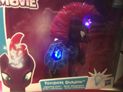 Size: 1200x900 | Tagged: safe, tempest shadow, pony, unicorn, g4, my little pony: the movie, official, armor, broken horn, brushable, electronic toy, eye scar, female, glowing, horn, irl, mare, photo, raised hoof, scar, solo, sparking horn, toy