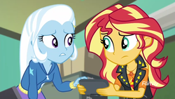 Size: 1280x720 | Tagged: safe, screencap, sunset shimmer, trixie, equestria girls, equestria girls specials, g4, my little pony equestria girls: better together, my little pony equestria girls: forgotten friendship, computer, discovery family, discovery family logo, female, remote