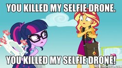 Size: 600x337 | Tagged: safe, edit, edited screencap, screencap, sci-twi, sunset shimmer, twilight sparkle, equestria girls, equestria girls specials, g4, my little pony equestria girls: better together, my little pony equestria girls: forgotten friendship, batman the animated series, image macro, meme, memeful.com, rock horse, selfie drone, the joker