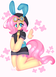 Size: 2483x3400 | Tagged: safe, artist:bunxl, fluttershy, pegasus, pony, semi-anthro, g4, anatomically incorrect, arm hooves, blushing, bunny ears, clothes, colored pupils, costume, cute, cutie mark background, dangerous mission outfit, female, goggles, heart, heart eyes, high res, hoodie, incorrect leg anatomy, kneeling, looking at you, mare, signature, simple background, smiling, solo, white background, wingding eyes
