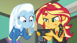 Size: 1280x720 | Tagged: safe, edit, edited screencap, screencap, sunset shimmer, trixie, equestria girls, equestria girls series, forgotten friendship, g4, clothes, discovery family logo, duo, female, nintendo switch, tongue out