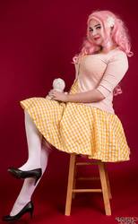 Size: 592x960 | Tagged: safe, artist:lochlan o'neil, fluttershy, human, g4, clothes, cosplay, costume, dress, irl, irl human, photo, pinup, sitting, socks