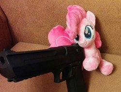 Size: 1000x761 | Tagged: safe, artist:shindeeru, pinkie pie, earth pony, pony, g4, beanie (plushie), c:, couch, cute, delet this, desert eagle, diapinkes, female, fluffy, gun, handgun, hoof hold, irl, mare, meme, photo, pistol, plushie, sitting, smiling, solo, weapon
