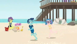 Size: 784x453 | Tagged: safe, screencap, henry handle, manestrum, technicolor waves, victoria, water lily (g4), equestria girls, g4, my little pony equestria girls: better together, unsolved selfie mysteries, background human, barefoot, beach, bikini, bucket, child, children, clothes, feet, legs, male, male feet, midriff, ocean, pier, running, sand, shorts, shovel, swimsuit, tankini, toddler