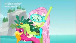 Size: 854x480 | Tagged: safe, screencap, fluttershy, equestria girls, equestria girls series, g4, unsolved selfie mysteries, beach, clothes, dive mask, female, fluttershy's wetsuit, geode of fauna, geode of shielding, goggles, hairpin, magical geodes, ocean, rock horse, seaweed, snorkel, solo, swimsuit, text, wet, wet hair, wetsuit