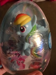 Size: 360x480 | Tagged: safe, rainbow dash, pony, g4, figure, hand, irl, jelly beans, photo, sitting, solo, toy