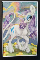 Size: 499x744 | Tagged: safe, artist:sparkynekomi, rarity, classical unicorn, pony, unicorn, g4, big ears, cloven hooves, curved horn, female, flower, glowing horn, horn, leonine tail, mare, solo, traditional art, unshorn fetlocks, watercolor painting