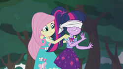 Size: 2208x1242 | Tagged: safe, screencap, fluttershy, sci-twi, twilight sparkle, equestria girls, equestria girls series, g4, stressed in show, stressed in show: fluttershy, blindfold, clothes, cute, female, geode of telekinesis, magical geodes, out of context, ponytail, skirt, smiling, tree